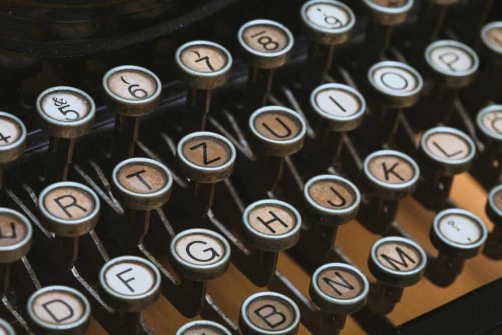 Typewriter key arms