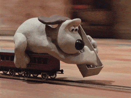 Gromit lays down track just in time as he rides over it